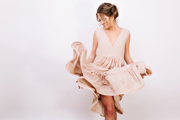 joyful-curly-girl-with-cute-hairstyle-playfully-posing-while-trying-new-stylish-dress-slim-young-woman-trendy-vintage-attire-dancing-isolated-white-background_197531-3621